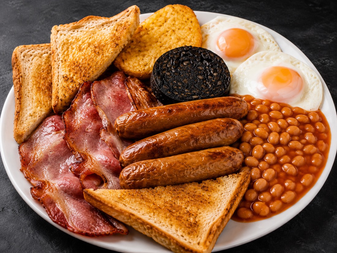 The Belly Buster — 3 bacon, 3 sausages, 2 eggs, black pudding, hash brown, beans and toast